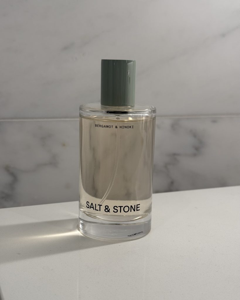 Salt & Stone Bergamot and Hinoki fragrance mist bottle on marble