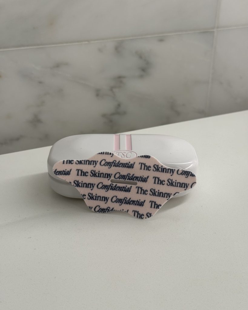 The Skinny Confidential mouth tape displayed on marble