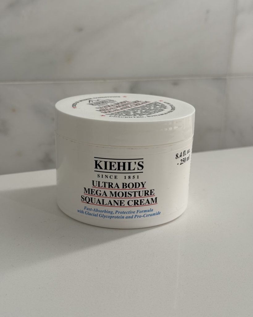 Kiehl's Ultra Body Mega Moisture Squalane Cream jar on marble