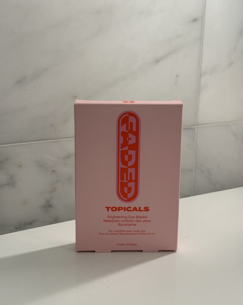 Pink Topicals Faded Under Eye Masks packaging on marble